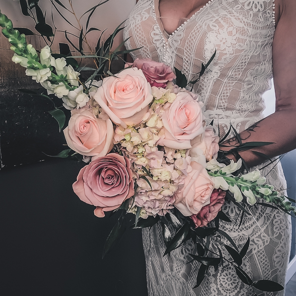 Lace Bridal Gown with Blush Pink Bouquet